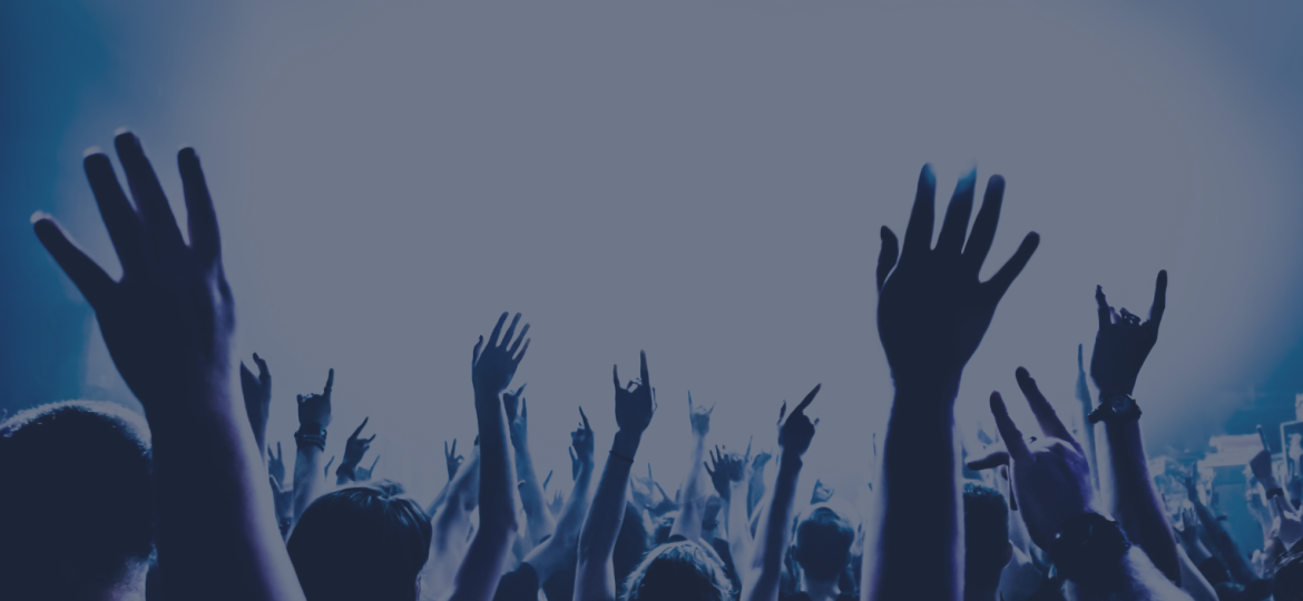 Busy crowd of people watching a musical performance, with a colourful geometric graphics line the bottom and an ‘EP Team’ logo appears in the corner.