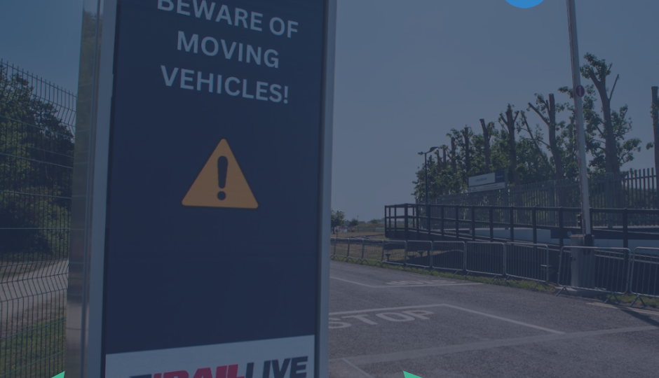 Large smart sign on the side of a road, with a colourful geometric graphics line the bottom and an ‘EP Team’ logo appears in the corner.